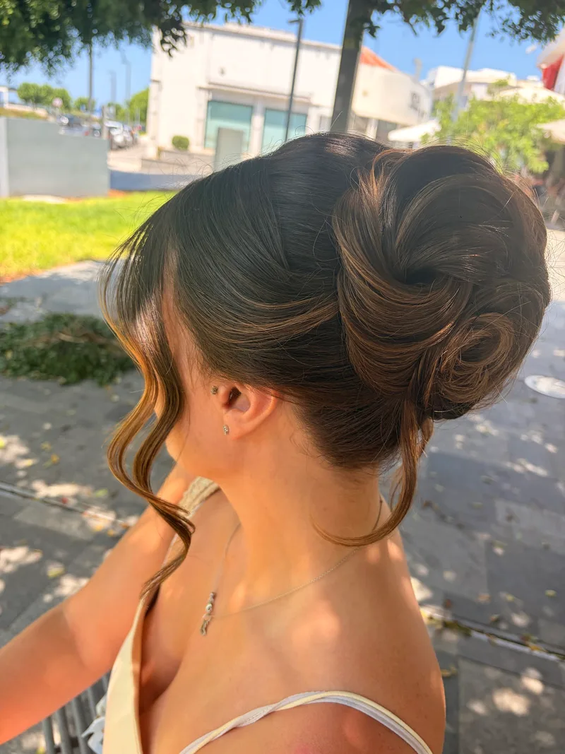 Elegant bridal updo with loose strands